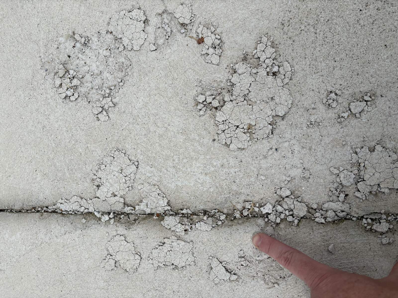Concrete driveway flaking near joint